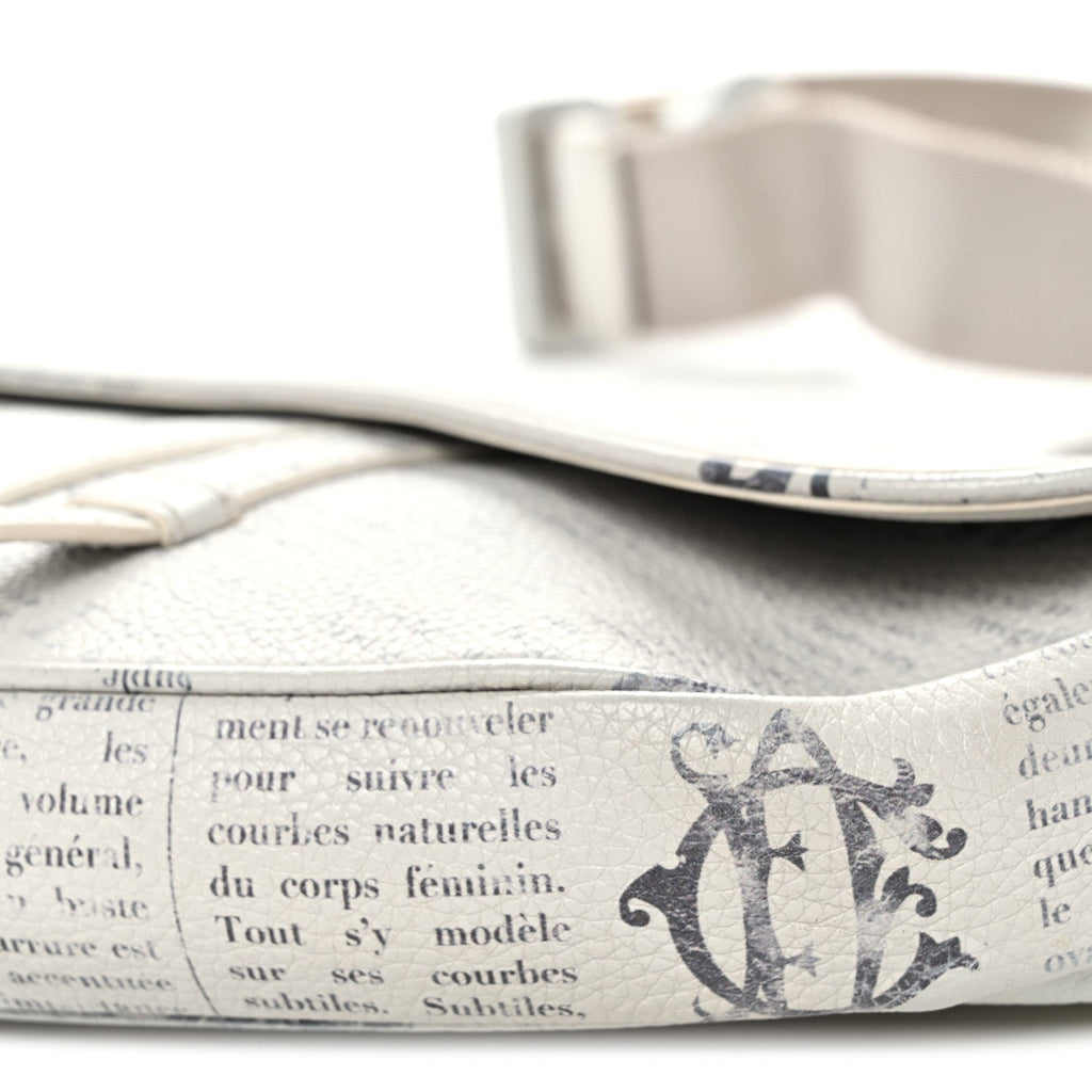 X Daniel Arsham Grained Calfskin Newspaper Print Saddle Bag White wholesalehk.shop