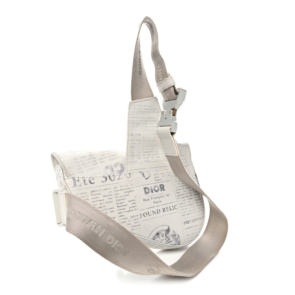 X Daniel Arsham Grained Calfskin Newspaper Print Saddle Bag White wholesalehk.shop