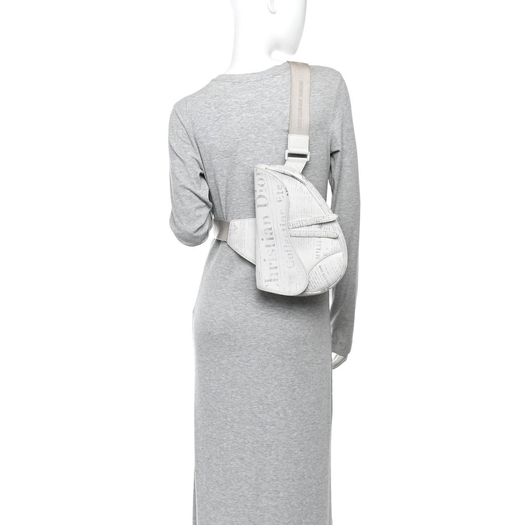 X Daniel Arsham Grained Calfskin Newspaper Print Saddle Bag White wholesalehk.shop
