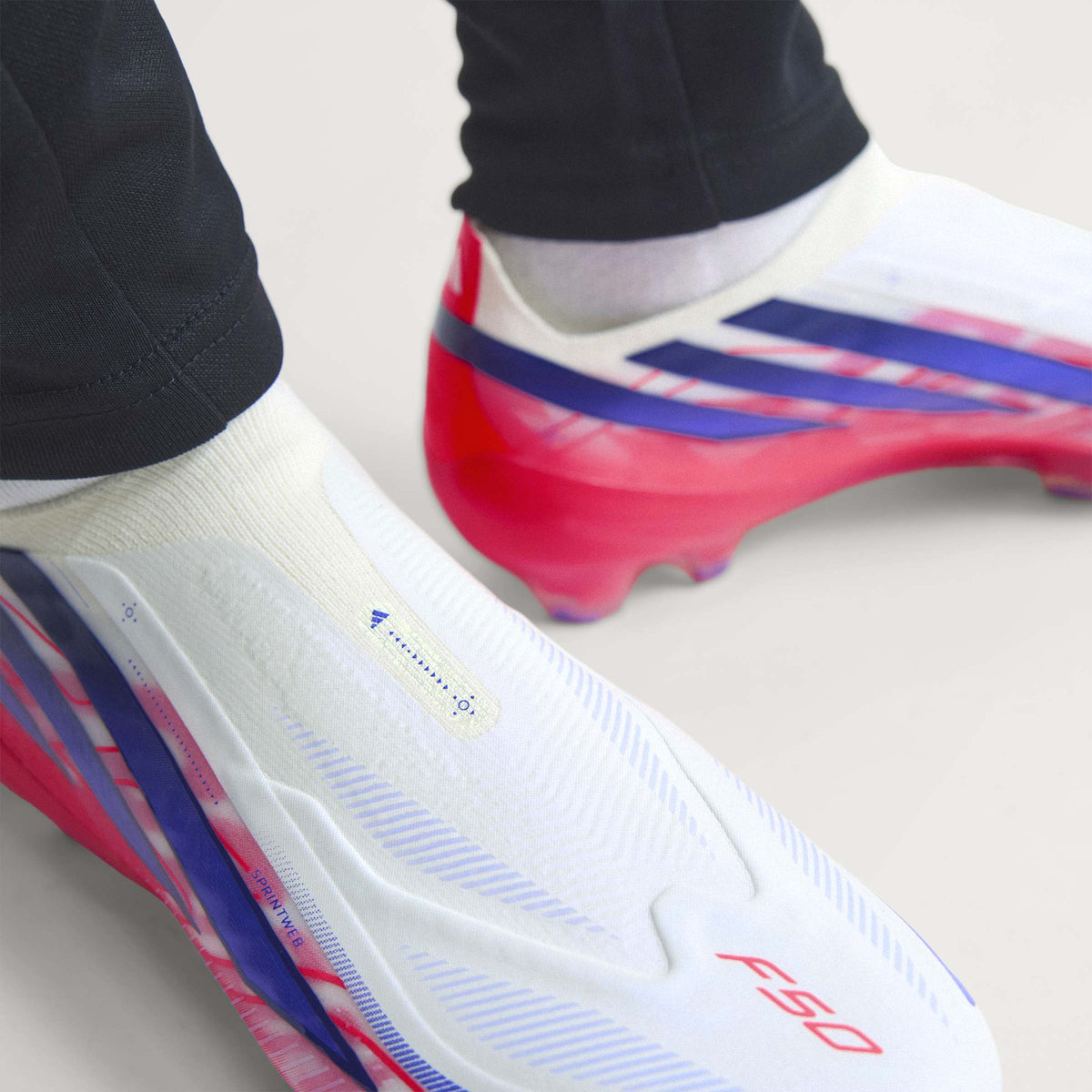 2026 New Arrival adidas F50 Hyperfast Elite Laceless Firm Ground Men's Soccer Cleats - White/Purple wholesalehk.shop
