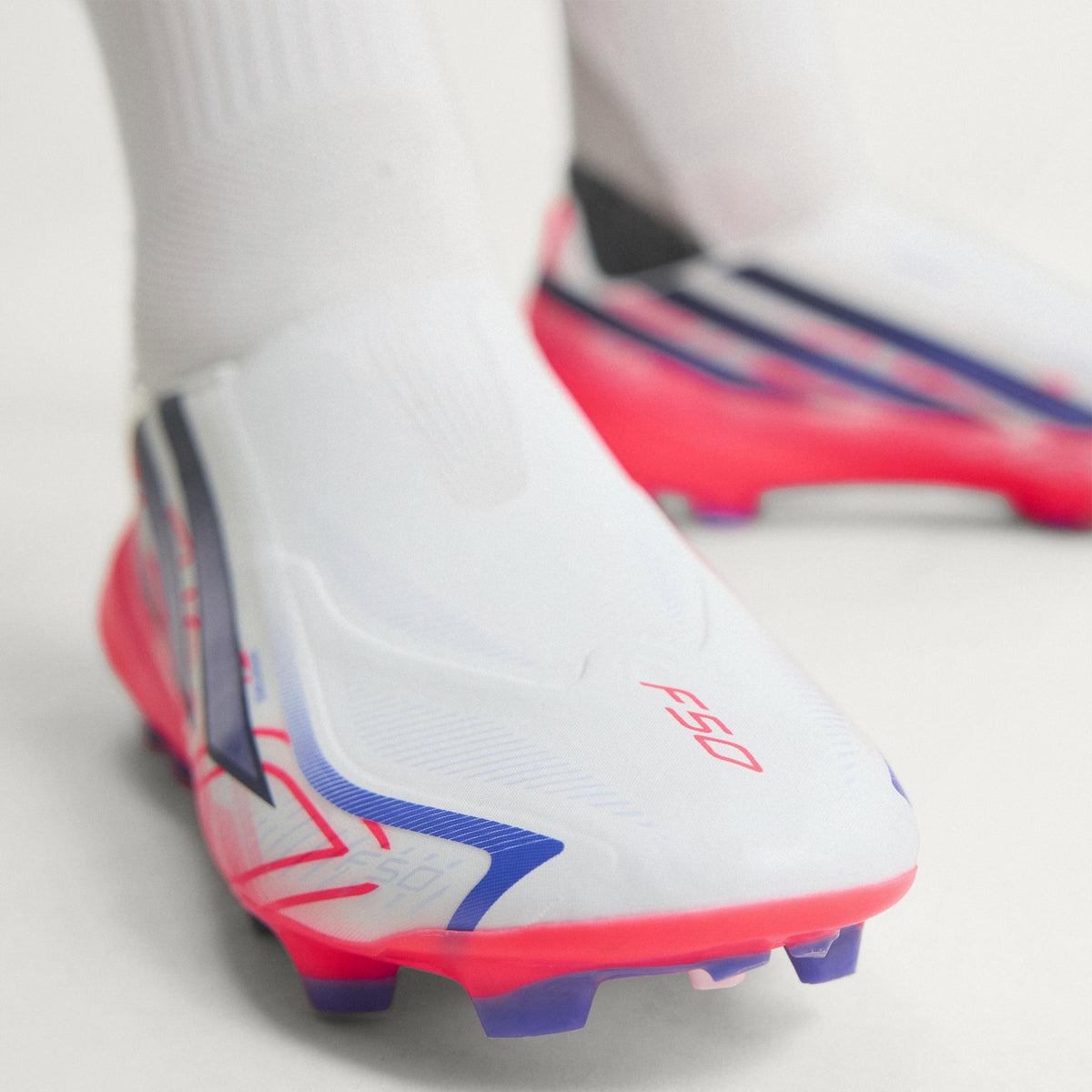 2026 New Arrival adidas F50 Hyperfast League Laceless FG Firm Ground Men's Soccer Cleats - White/Purple/Solar Turbo wholesalehk.shop