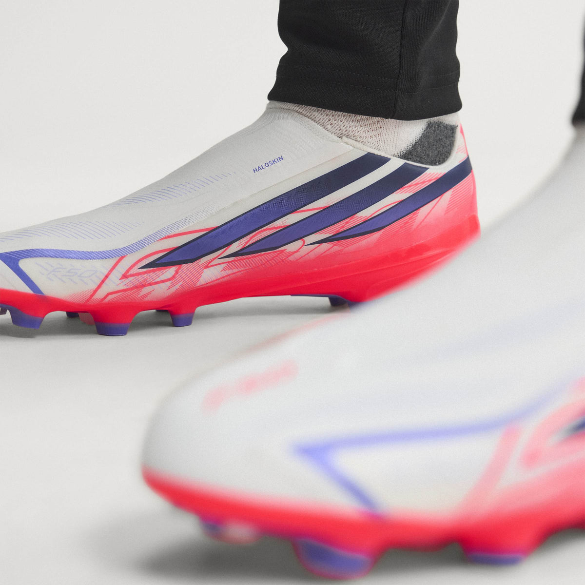 2026 New Arrival adidas F50 Hyperfast League Laceless FG Firm Ground Men's Soccer Cleats - White/Purple/Solar Turbo wholesalehk.shop