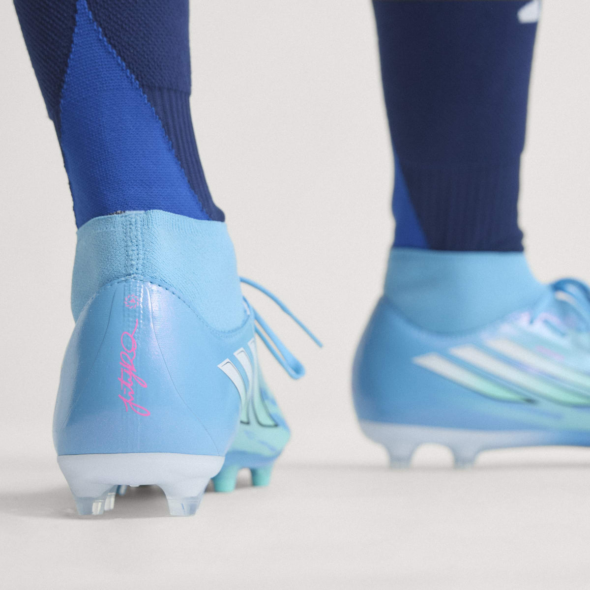 2026 New Arrival adidas F50 Sparkfusion League Mid Cut Firm Ground / Artificial Gras Men's Soccer Cleats - White/Pink wholesalehk.shop