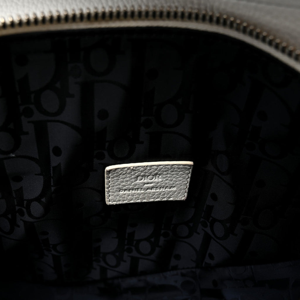 X Daniel Arsham Grained Calfskin Newspaper Print Saddle Bag White wholesalehk.shop