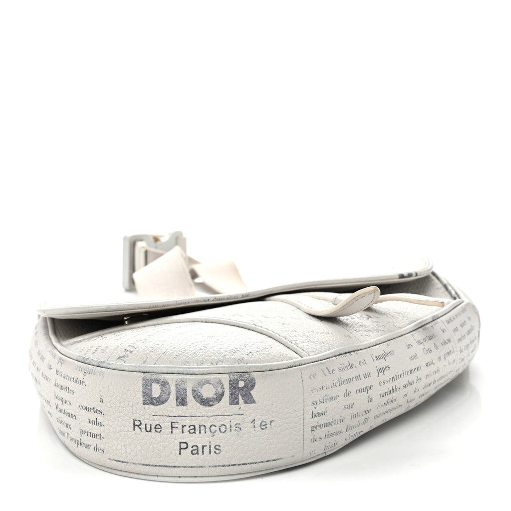 X Daniel Arsham Grained Calfskin Newspaper Print Saddle Bag White wholesalehk.shop